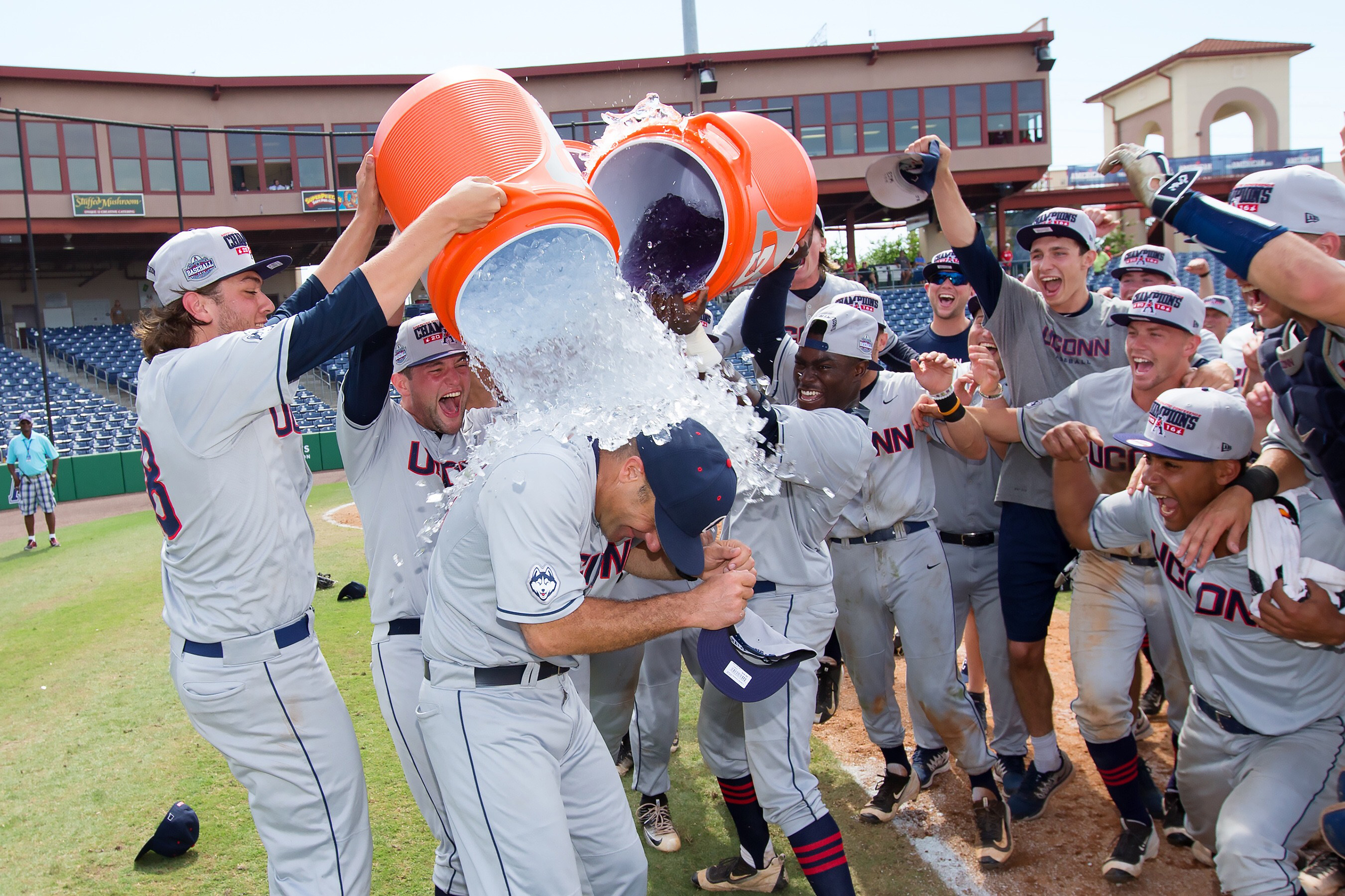 Penders led the Huskies to their first-ever American Athletic Conference crown last season. Here he is seen doused with ice and Gatorade by his team.