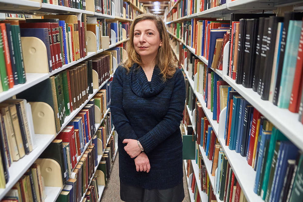 Associate professor and acclaimed novelist Ellen Litman with Illustration of Russian Architecture in a Papercut style